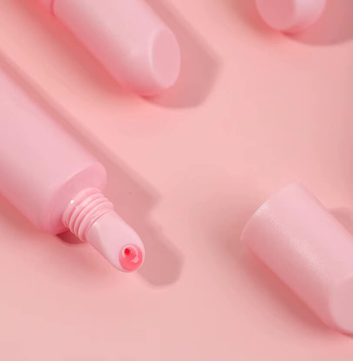 Close-up of LaserGlow Polypeptide Lip Repair Oil bottle showcasing luxury packaging and clinically formulated lip care with HA5, Arnica, Vitamin E, and Shea Butter
