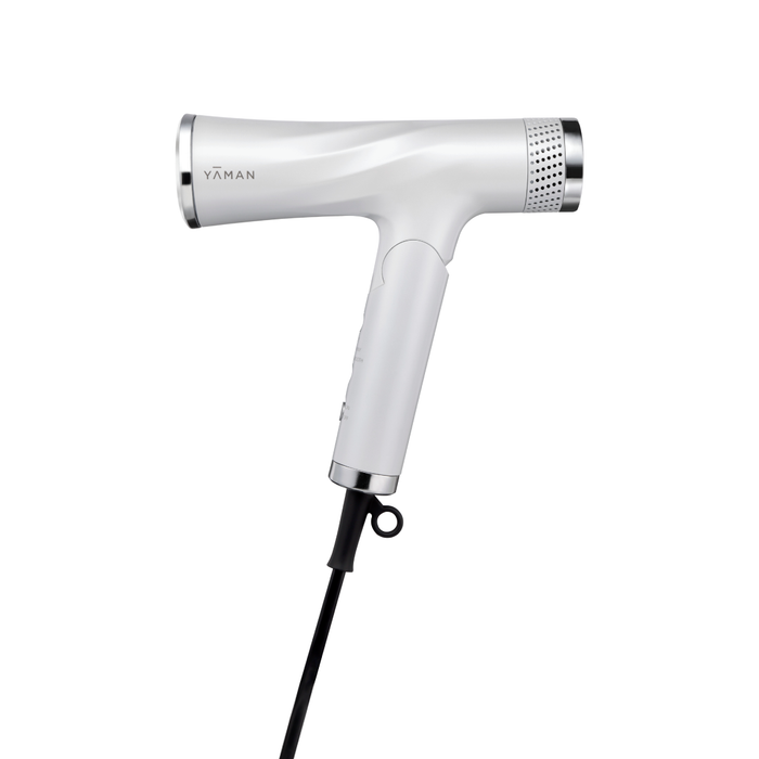 White hair dryer with 'YAMAN' branding on a white background