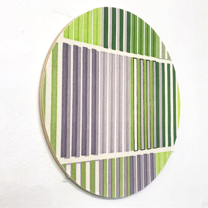 The artwork 'Line Study 2' by Molly Koehn features geometric vertical stripes in alternating shades of green and gray on raw silk, mounted on a circular birch panel. The composition creates a modern, minimalist pattern with clean parallel lines divided into distinct sections, showcasing a harmonious blend of natural and muted tones. By Molly Koehn.