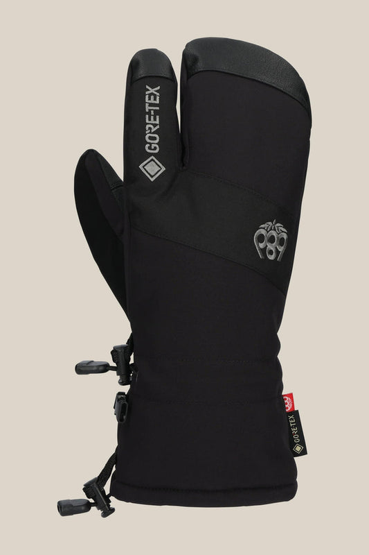 The 686 Men's GORE-TEX Linear Trigger Mitt, a black three-finger men‚Äôs mitt with GORE-TEX branding, embroidered logo, and adjustable PU wrist straps, is displayed upright against a plain beige background.