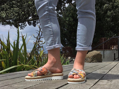 Aerobics are quality European women's sandals and slides. Soft leather with crossover detail in camel. Espadrille detail around the sole unit.