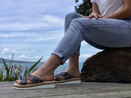 Aerobics are quality European women's sandals and slides. Soft leather with crossover detail in black. Espadrille detail around the sole unit.
