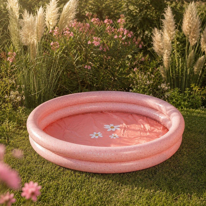 Rosa Kinderpool für Babys und Kleinkinder im Garten mit Blumenmotiv – aufblasbares Planschbecken für Wasserspaß im Sommer.