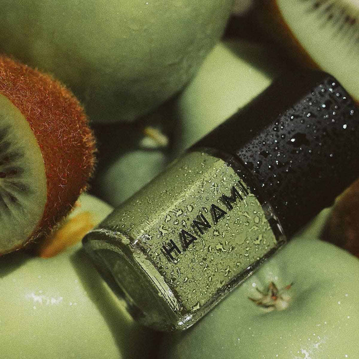 Nail polish with 'HANAMI' branding on a kiwi fruit background.