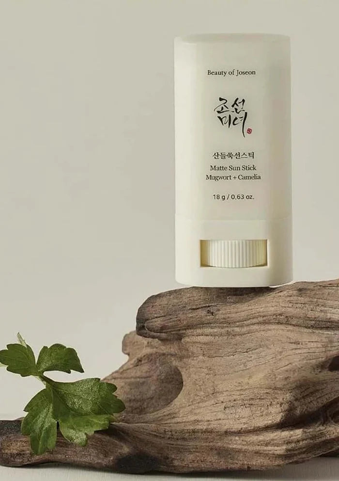 Beauty of Joseon stick on a wooden surface with a neutral background