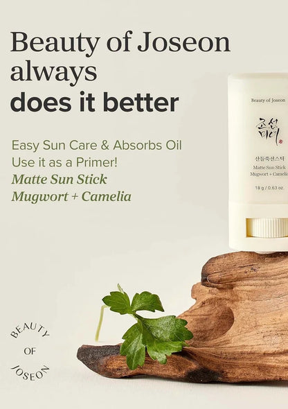 Beauty of Joseon Matte Sun Stick with mugwort and camellia on a wooden block against a light background