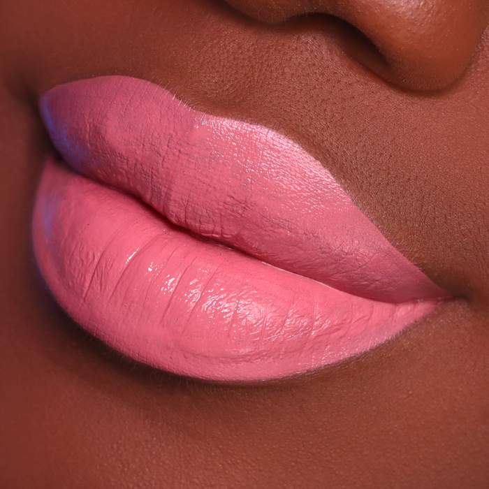 Best Life rosy pink lipstick on lips, deep skin tone close-up