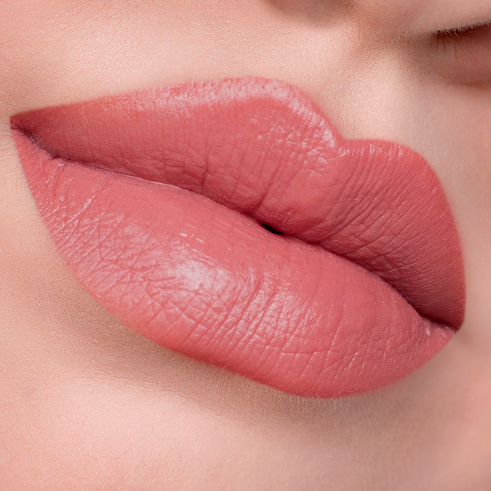 Best Life rosy nude lipstick on lips, light skin tone close-up