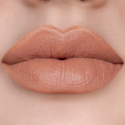 Caramel nude brown lipstick on lips, light skin tone