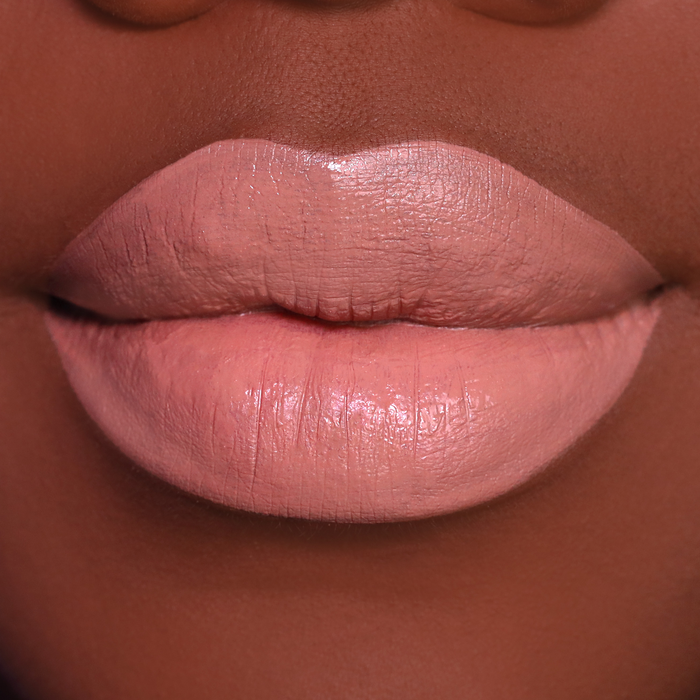 Caramel nude brown lipstick on lips, medium-deep skin tone