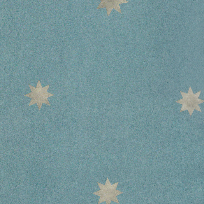 Charlie Harbor blue wallpaper with scattered starburst motifs made to order in the USA with short lead times