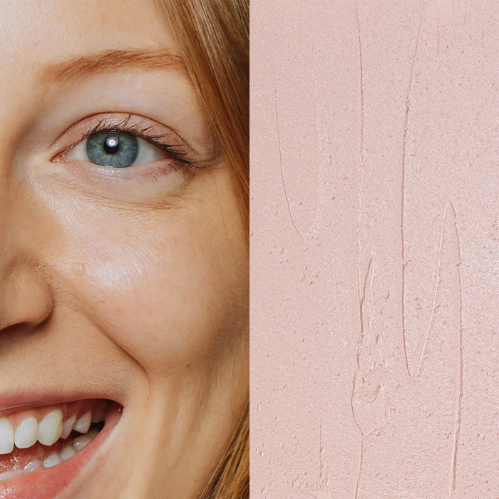 Model next to swatch of Elate Beauty Creme Concealer in the shade 'CC1', for light cool skin tones. A two-in-one concealer and illuminator formulated with evening primrose oil, designed to heal and conceal blemishes.