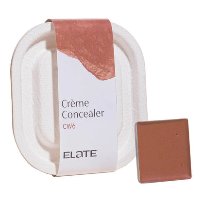 2.7ml pan of Elate Beauty Creme Concealer in the shade 'CW6', for medium deep warm skin tones. A two-in-one concealer and illuminator formulated with evening primrose oil, designed to heal and conceal blemishes.