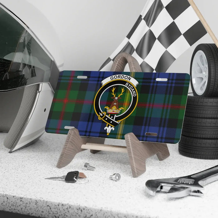Scottish clan crest aluminum license plate shown front-on, tartan background, made to order