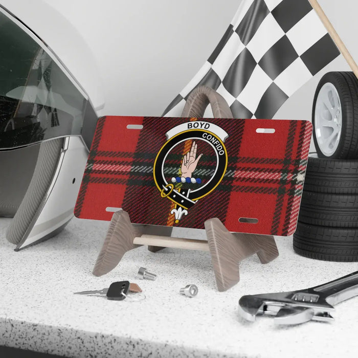 Boyd crest novelty license plate on display stand, with Confido over a tartan background