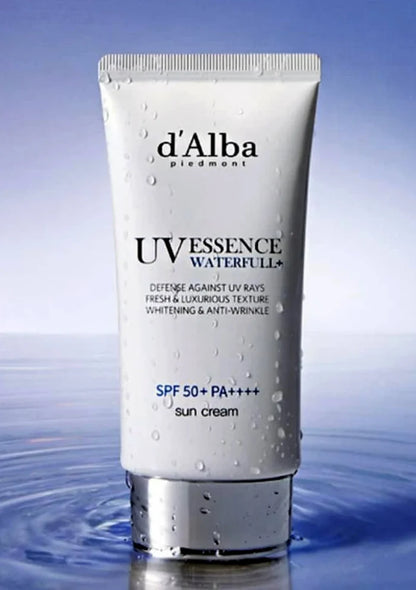 Tube of d'Alba UV Essence Waterful sun cream on a blue water background