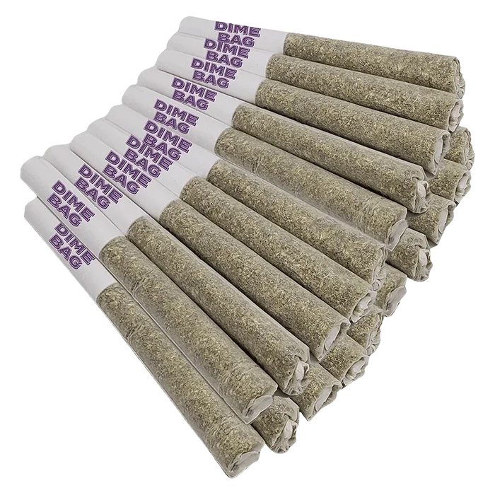 Angled close-up of a stacked row of Doozies Tropical Pocket Puffs PR 20 x 0.5 g pre-rolls with white purple‑stamped tips and tightly packed greenish herb ends.
