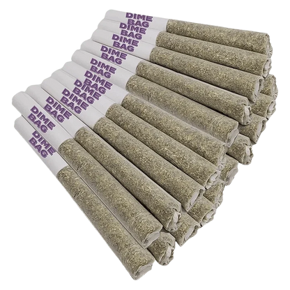 Angled close-up of a stacked row of Doozies Tropical Pocket Puffs PR 20 x 0.5 g pre-rolls with white purple‑stamped tips and tightly packed greenish herb ends.