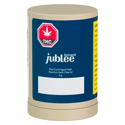 Front-facing shot of the Jubilee Extracts East Coast Aged Hash cylindrical 2g container with a blue label and red THC symbol.