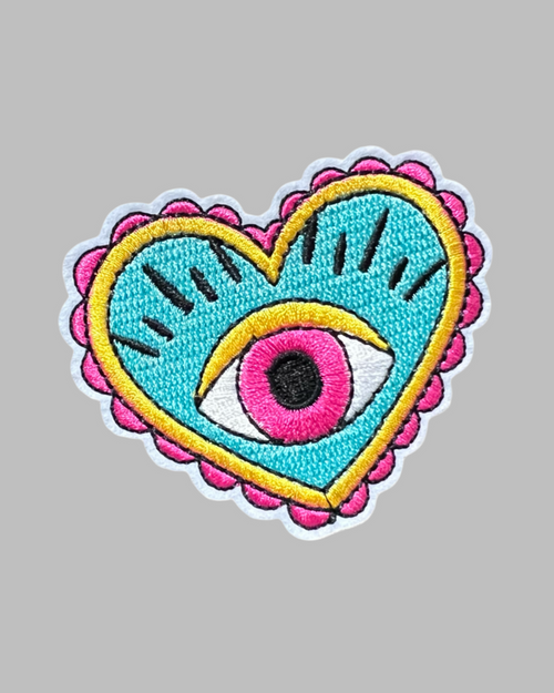 Evil eye colorful heart embroidered iron on patch sold by Le Monkey House
