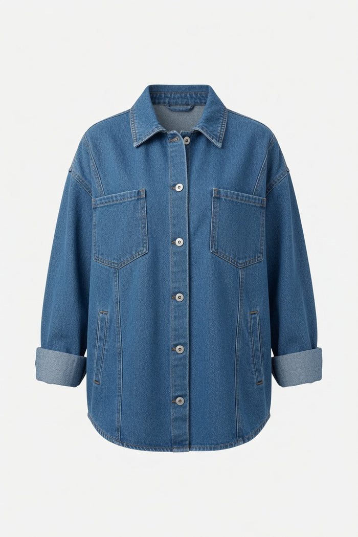 A blue denim button-up shirt jacket with a pointed collar, two chest flap pockets, and rolled cuffs, shown against a plain light gray background.
