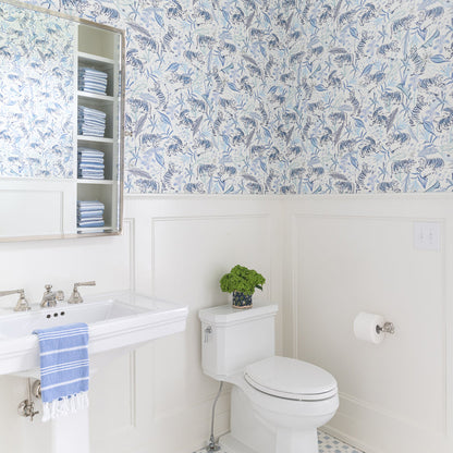 Bathroom with Frida Blue wallpaper featuring hand-painted blue botanical and animal designs, made-to-order, quick delivery, USA made