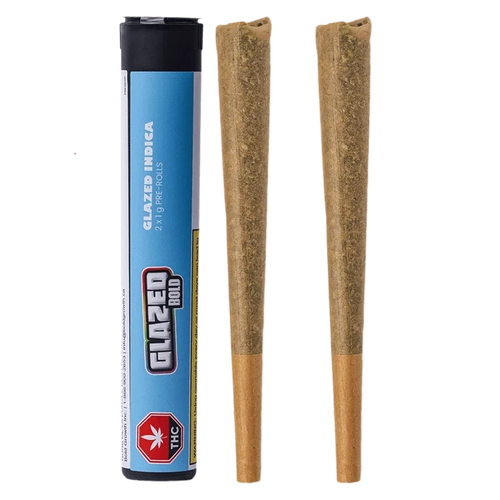 Product-shot front view of the Glazed Indica PR 2 x 1 g tube standing beside two cone-shaped pre-rolls on a white background.