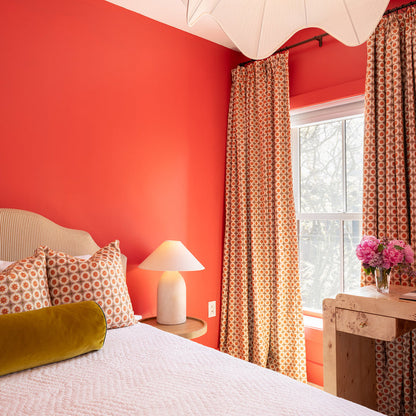 Hayes Coral patterned curtains in a vibrant bedroom made to order in the USA with short lead times