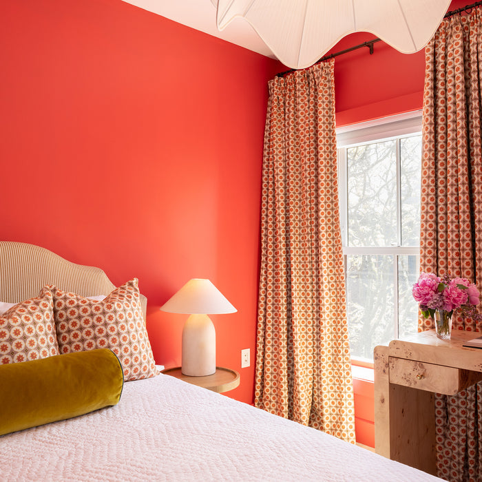 Hayes Coral patterned curtains in a vibrant bedroom made to order in the USA with short lead times