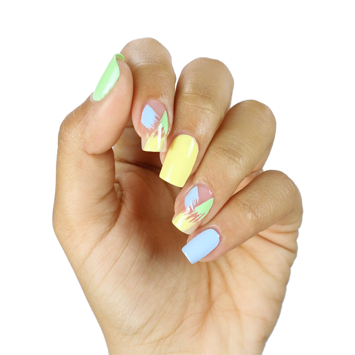 Hooray of Sunshine yellow with pastel rainbow mix-and-match manicure on a medium skin tone