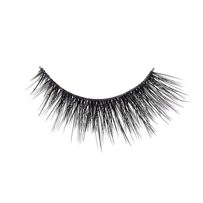Close up of black fringe tassels forming a curved arc against a white background