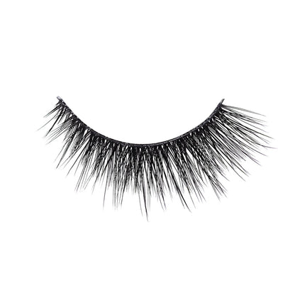 Close up of black fringe tassels forming a curved arc against a white background