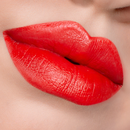 Island Girl bright orange red lipstick on lips, light skin tone close-up