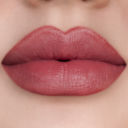 Just Right rosewood lipstick on lips, light skin tone