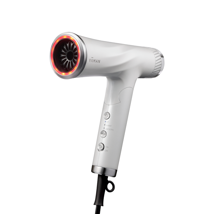 White hair dryer with red interior on a white background