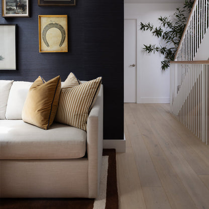 Louisa Camel striped throw pillow on a white sofa, made to order in the USA with short lead times
