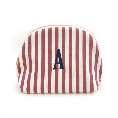 Louisa Cranberry pouch with vertical cranberry and white stripes, gold zipper, and navy monogram A, customizable design