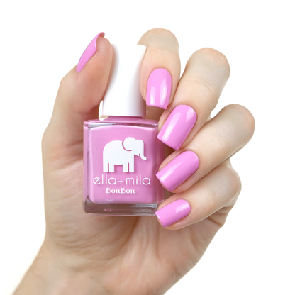Macaruin My Diet pastel purple pink nail polish on a medium skin tone, hand holding the bottle