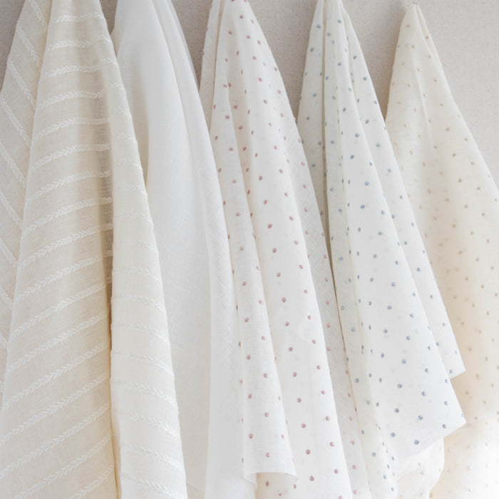 interior design mood board with sheer white fabric, sheer natural fabric with white embroidered stripes, sheer white fabric with cream embroidered polka dots, sheer white fabric with blue embroidered polka dots and sheer white fabric with embroidered pink polka dots