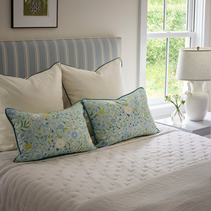 Lucie Chamomile bed styled with floral pillows and quilted bedding, made-to-order in the USA with quick lead times