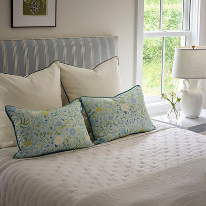 Lucie Chamomile bed styled with floral pillows and quilted bedding, made-to-order in the USA with quick lead times