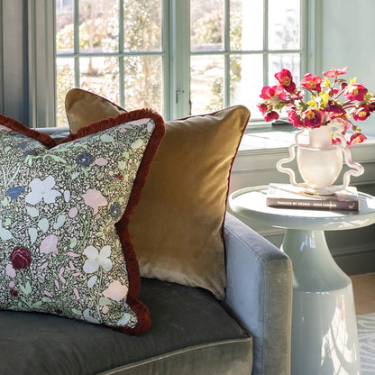 Matilda floral throw pillow with burgundy trim on a sofa, made to order in the USA with short lead times