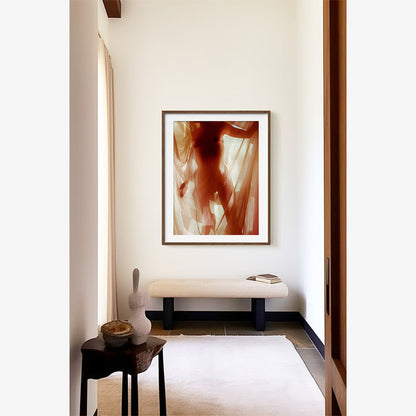 Abstract photograph depicting a nude body shrouded in translucent red fabric framed in a dark brown wood