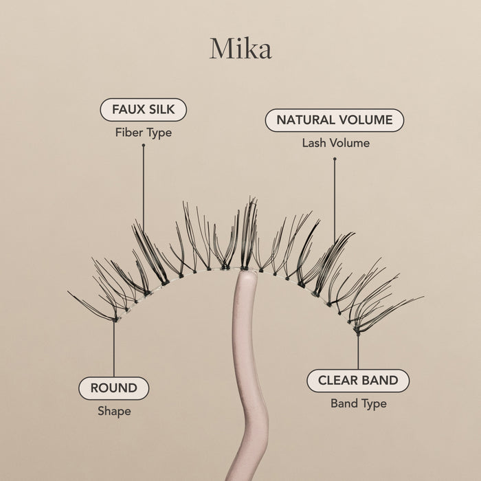 Mika false eyelash with faux silk fibers, natural volume, round shape, and a clear lash band.