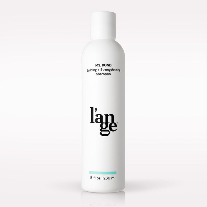 L’ange Ms. Bond Building + Strengthening Shampoo on a blank background