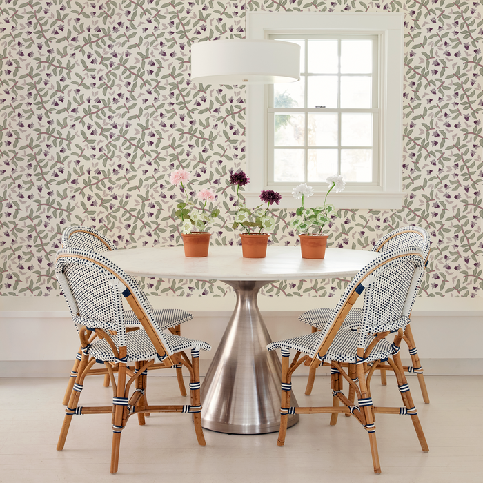 Nellie Plum made-to-order wallpaper with delicate purple florals and green leaves, crafted in the USA with fast lead times