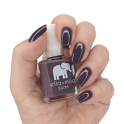 Night In dark pastel purple nail polish manicure on a light skin tone with the bottle