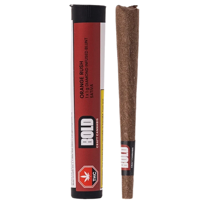 Studio-lit front view of the Orange Crush Blunt 1 x 1 g showing a red cylindrical tube labeled BOLD next to a brown pre-rolled blunt.