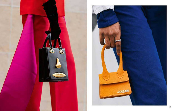 Two handbags, one black with gold accents and one orange, held by people in red and blue outfits.