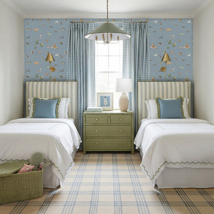 Twin bedroom with Pippa Powder wallpaper in soft blue featuring animals, paired with green plaid curtains and striped headboards